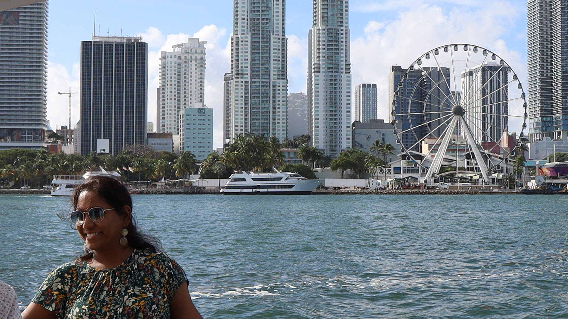 A woman poses for a photo during her Miami Venetian Islands Cruise.